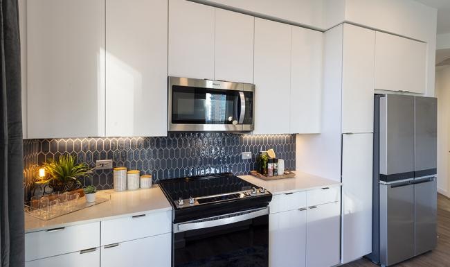 a kitchen with white cabinets
