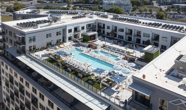 a high angle view of a rooftop swimming pool